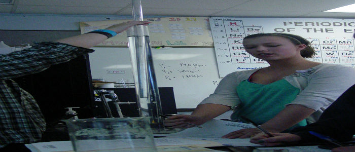 Juliet McKinney observes the movement of the inner tube which increases the pressure of the gas inside the tube.